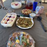 Photo of North Perth Community Garden member's food dishes for sharing including fritters, cake, cup cakes and cordials.